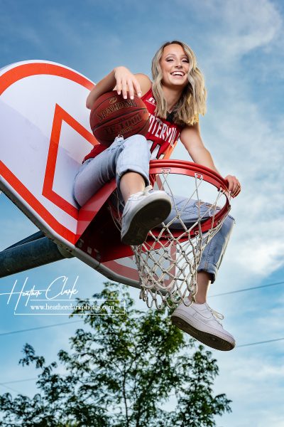 Girl on basketball hoop with uniform in Centerville, Iowa.